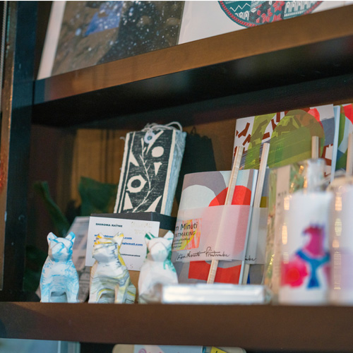Shelf of a homeware store with items for sale